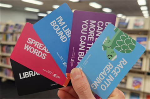 Member cards being held in a fan shape
